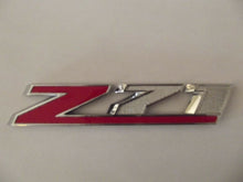 Load image into Gallery viewer, OEM GM 2014-2015 Chevrolet Silverado 1500 Z71 Front Grille Emblem Badge 23432559
