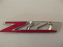 Load image into Gallery viewer, OEM GM 2014-2015 Chevrolet Silverado 1500 Z71 Front Grille Emblem Badge 23432559
